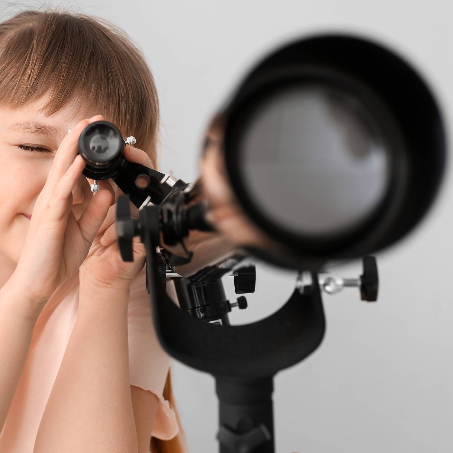 A child's telescope on a tripod